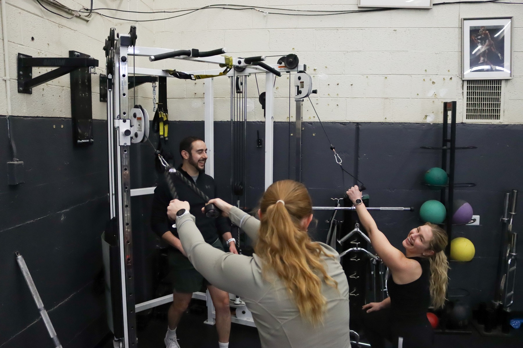 Partner training session using cable machines